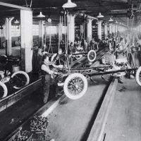 The Dodge Main assembly in 1916 adopted the moving assembly line pioneered by Henry Ford at his nearby Highland Park plant. Inset: Cars await shipment from Dodge Main. Dodge Brothers used steel bodies and enamel paint that could be cured in ovens, significantly shortening the time it took to produce cars.