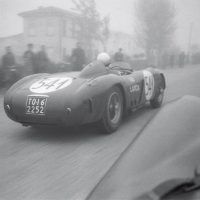 Mille Miglia May 1 and 2, 1954 Klem photographs former World War II prisoner Luigi “Gino” Valenzano’s Lancia D24 (0009) from Parnell’s DB3S in the early morning fog of the Mille Miglia. Valenzano (1920 –2011), who had known Gianni Lancia from childhood, drove for Lancia at Sebring in 1954 where he finished 2nd, sharing a car with the notorious playboy Porfirio Rubirosa, but would later crash out here. He continued competing the following year for Maserati but retired from racing after his brother Piero was killed during the 1955 Coppa d’Ore delle Dolomiti. Parnell/Klemantaski meanwhile would also crash out, near l’Aquila, without injury.