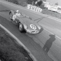 Le Mans June 11 and 12, 1957 Aston Martin entered three team cars at Le Mans plus Jean Kerguen’s “customer” DB3S. Two of them were the DBR1/300s for Tony Brooks/Noel Cunningham-Reid (DBR1/2) and Roy Salvadori/Les Leston (DBR1/1). This is Les Leston (1920–2012) rounding Mulsanne corner with Klemantaski’s shadow making a guest appearance on film. The car retired after 112 laps with a fractured oil pipe.