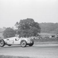 Donington GP October 2, 1937 Bernd Rosemeyer was the fastest man on a GP grid and the 6-liter 520 bhp V-16 Auto Union a formidable weapon if you could handle its rear-weighted bias and swing-axle rear suspension. Nevertheless, Manfred von Brauchitsch’s Mercedes-Benz W125 might have won, but a rear tire blew at 160 mph on the Starkey Straight and he had to settle for second place. Rosemeyer flies over the Melbourne Rise on his way to victory. Unlike the Mercedes, which took off front end first, the rear-engined Auto Unions lifted off at the rear.