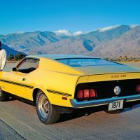 Evidence indicates that this yellow 1971 Boss 351 started out as a Boss 302, possibly 1F02G100053, before the decision was made to discontinue the small displacement Boss Mustang. The car was used for a series of publicity photos. The “5” and “1” on the decals appear to have been retouched to revise the “302” lettering to “351.” Ford Motor Company Photo