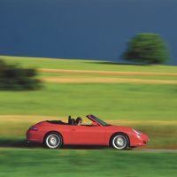 With its wind deflector in place, the 996 Cabrio showed off the graceful lines Pinky Lai had labored to produce. Cabrio buyers received an aluminum hardtop as part of their purchase price. Porsche Archiv