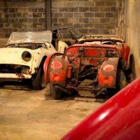 Although these Triumph TR3s are rough, there are enough of them that at least one complete car could be fabricated. Additionally, the owners of British Auto Restorations have loads of spare parts for Triumph.