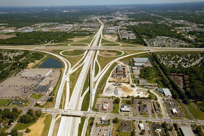According to TRIP, Michigan’s roads and highways carried 95 billion vehicle miles of travel in 2012. Aerial photo of the US 131/M-6/68th St. interchange in Wyoming, MIchigan looking north. Photo: Michigan Department of Transportation. 