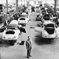 It was a long way from the converted sawmill in Gmünd to the Porsche factory in Zuffenhausen, but Ferry Porsche (foreground) had been determined to succeed, and by 1960, when this picture was taken, production was racing along. Hardly what one imagines when talking about an “assembly line” nowadays, each car still had that personal, almost hand-built quality about it. Photo: Porsche Werkfoto.