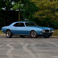 At first glance, the Firebird’s connection to the Chevrolet Camaro was evident, as the basic body platform was shared. But Pontiac’s styling department instilled the Firebird with many traditional design cues, including the split front grille and emblems, while Pontiac Engineering slid Pontiac-unique engines under the hood.