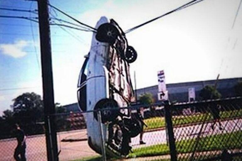 Car hanging from power line