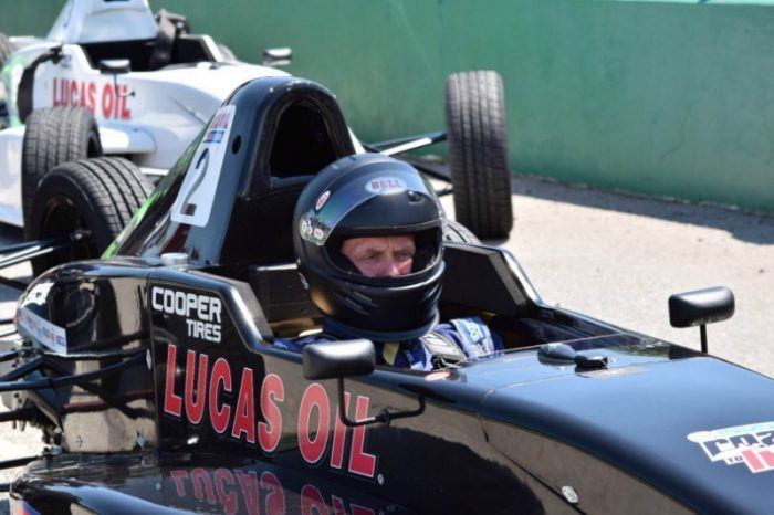 Photo of author in race car