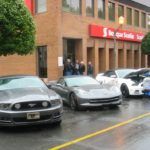 Mustangs squeezing a Corvette