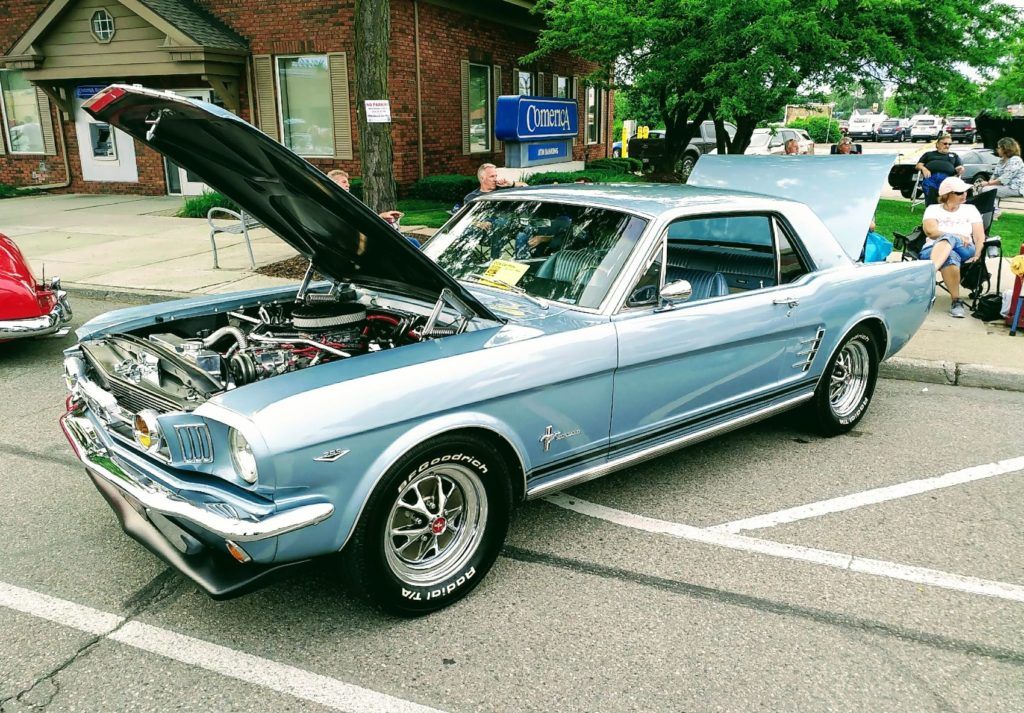 A classic Ford Mustang basks in the evening sun during the Allen Park Downtown Development Authority's Classic Car Show on June 19, 2019. The annual show in Allen Park, Michigan attracts collectors and car enthusiasts from all walks of life.