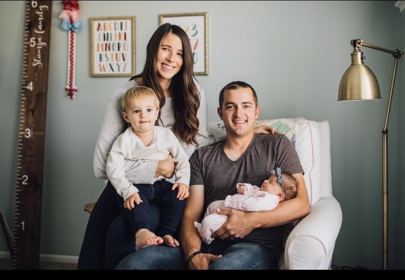 Kelly Suntrup Stumpe, aka The Car Mom, with her husband Tyler and their children George (almost two) and Hattie (five months).