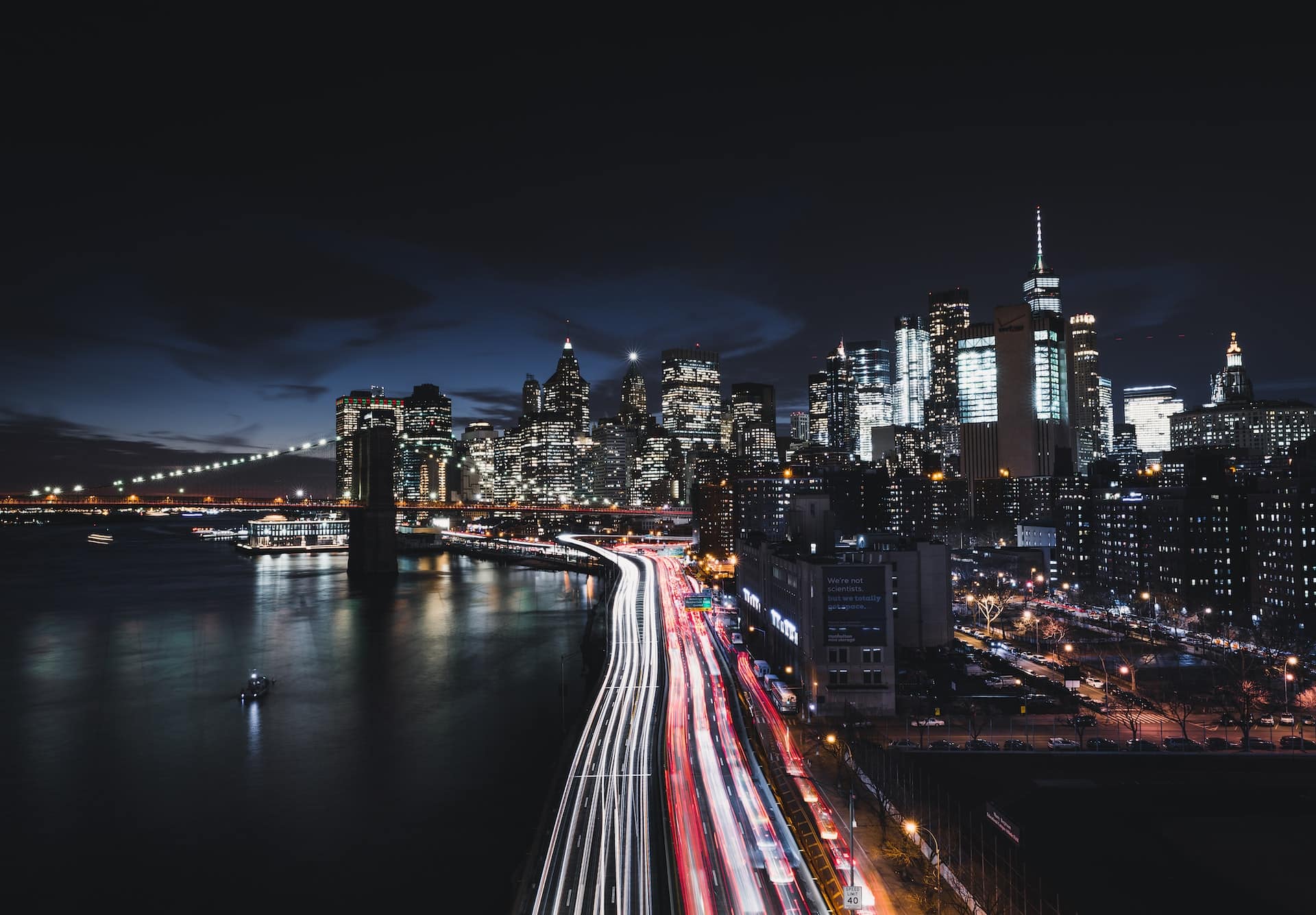 a nighttime long exposure photo of traffic in new york city with red and white lights