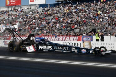 Justin Ashley's Top Fuel dragster at one of the events on the NHRA schedule