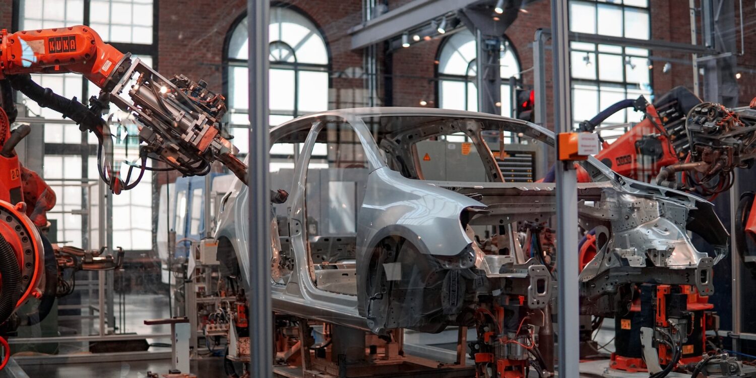 a car being assembled at a factory as the threat of another chip shortage looms