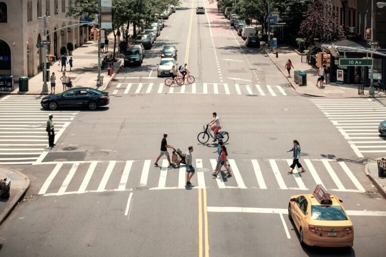pedestrians crossing a street in new york city
